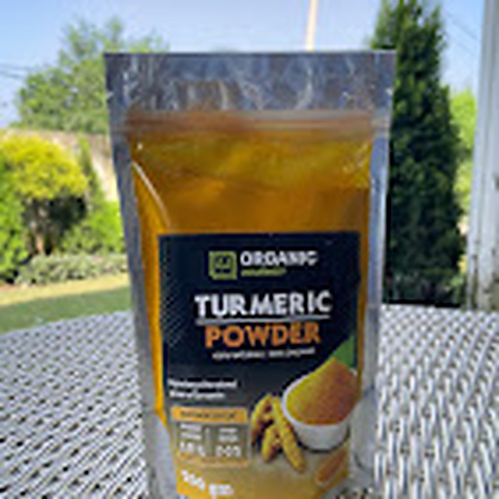Organic Journey turmeric powder pouch photographed outdoors